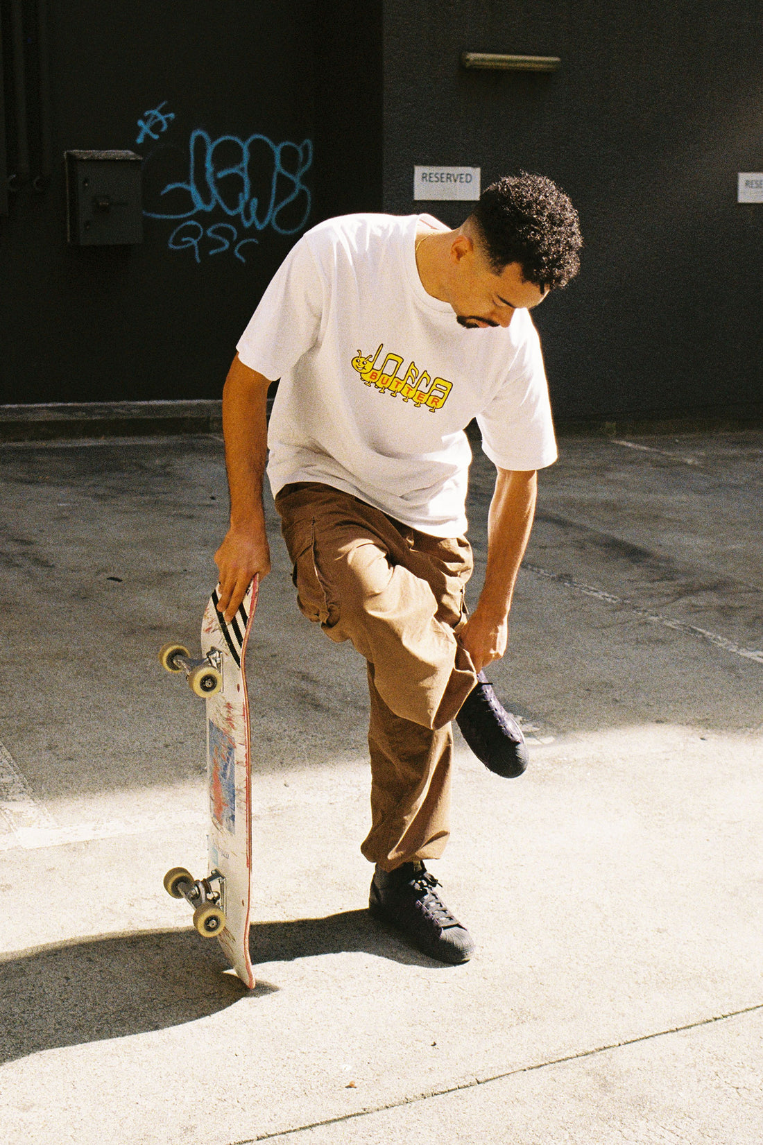 phil marshall wearing butter goods