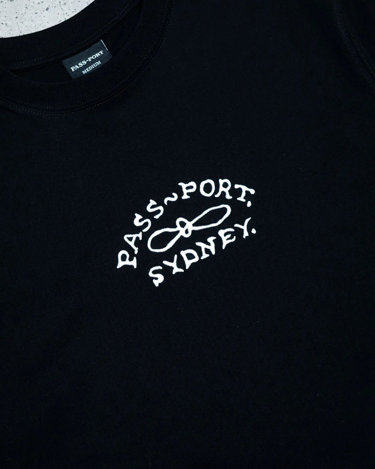 pass port moniker embroidered organic tee black
