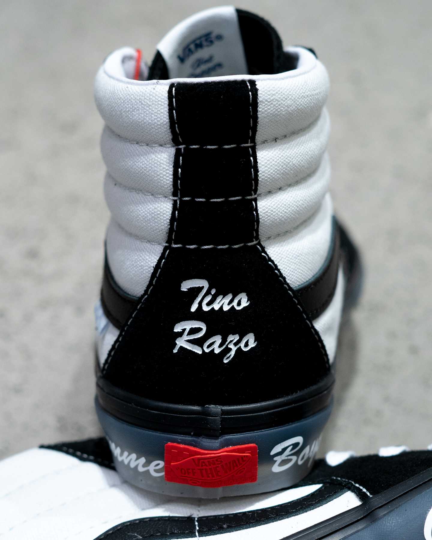 tino razo branding on heel of black and white vans sk8 hi