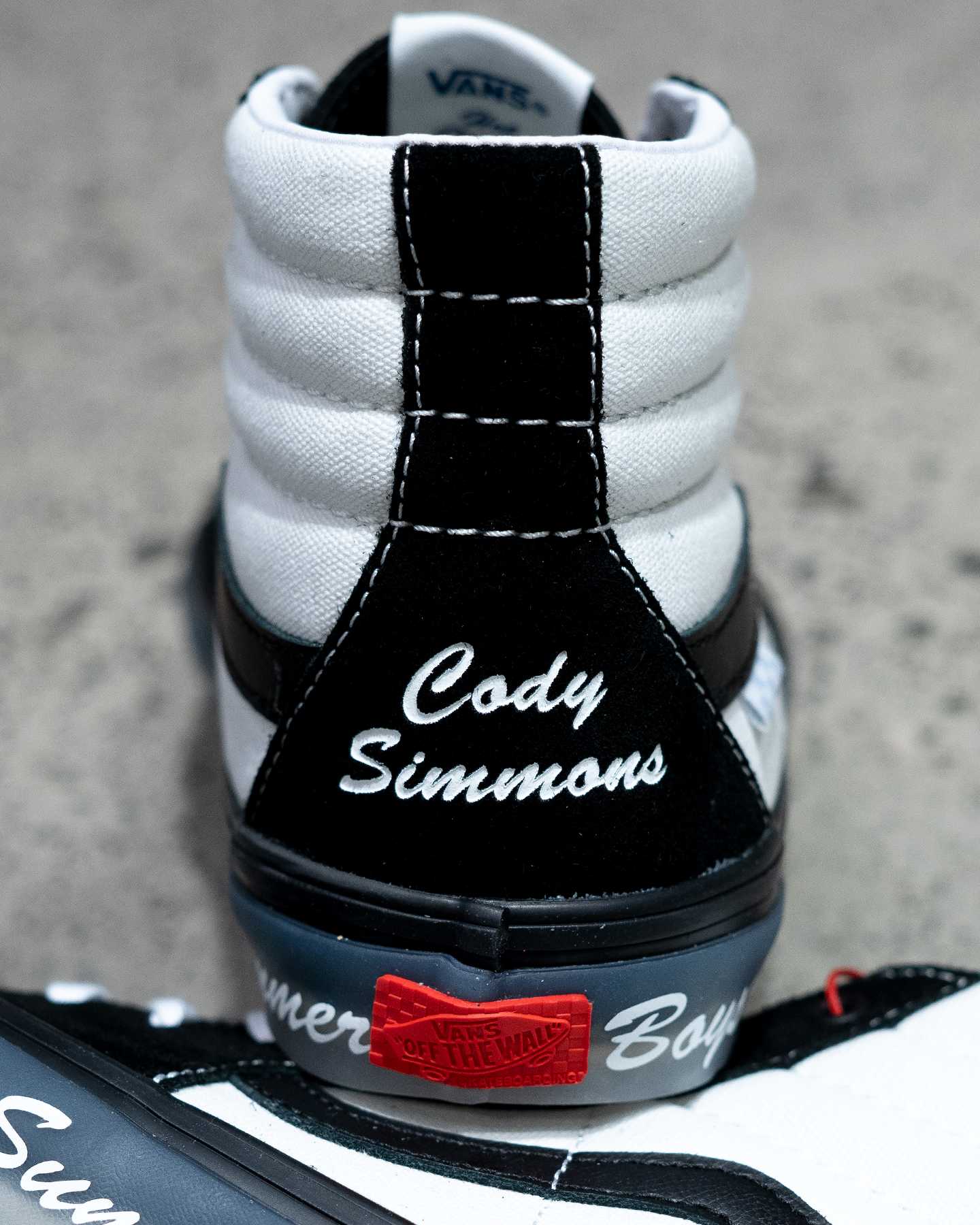 cody simmons branding on back of black and white sk8 hi